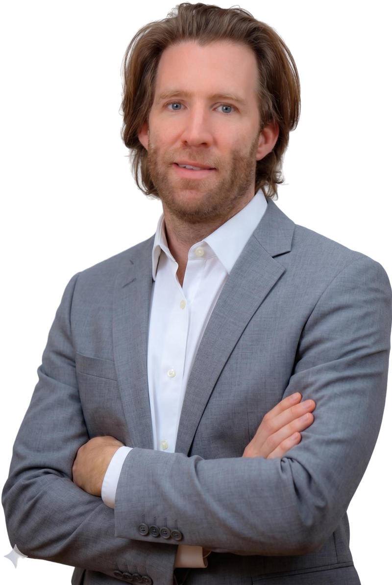 Male international tax advisor with blue eyes smiling slightly.
